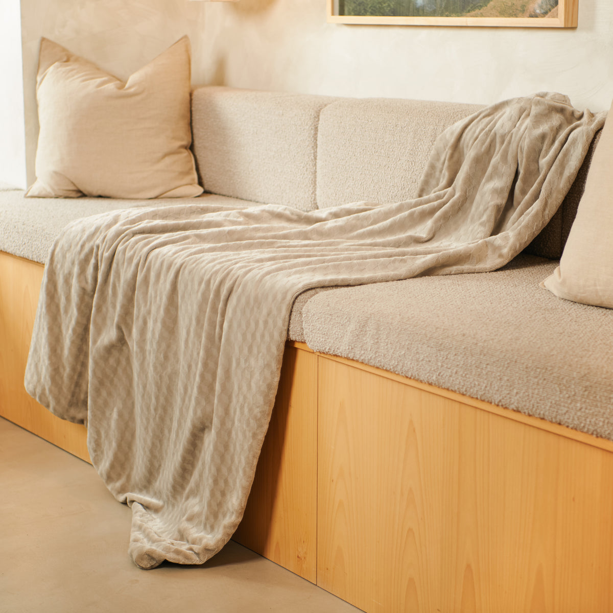 An Indulgent Days Throw draped over a sofa