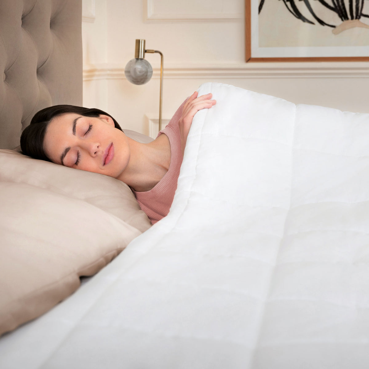 Woman sleeping under a Dreamland heated duvet